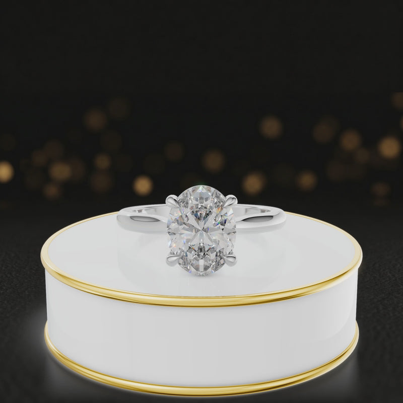 360-degree rotating view of a 1.5 carat oval cut diamond solitaire engagement ring in an 18kt white gold 4 claw setting by TJ Diamond.