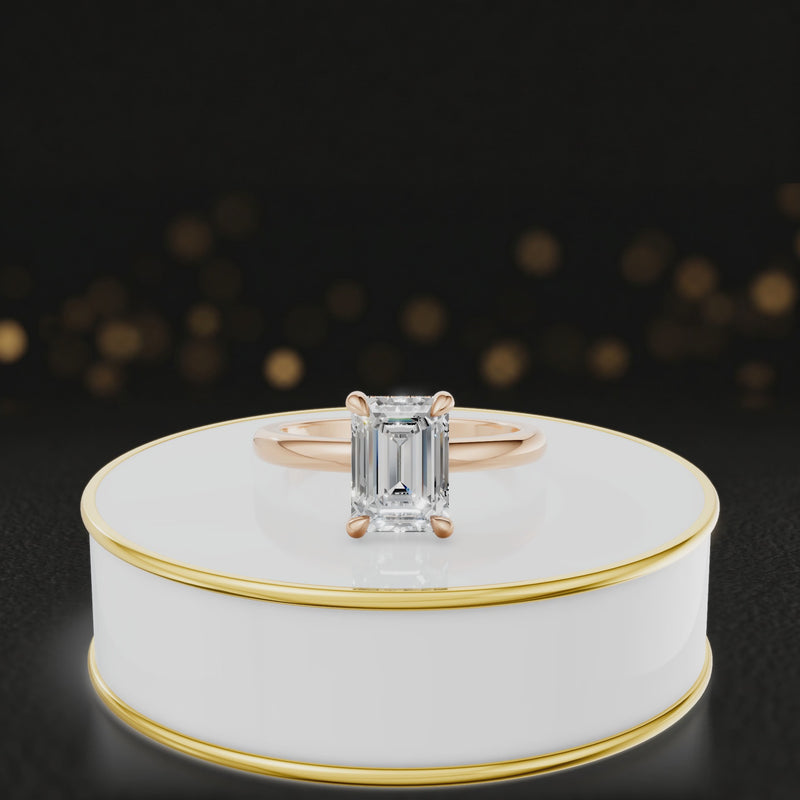 Alt text: 360 degree spinning video of 4-claw emerald cut engagement ring with hidden halo in 18kt rose gold