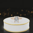 Alt text: 360 degree spinning video of 4-claw emerald cut engagement ring with hidden halo in 18kt rose gold