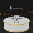360° product view of a radiant cut split shank lab-grown diamond engagement ring in 18kt white gold featuring a radiant-cut centre diamond, classic four-claw cathedral setting and diamond-set split shank.