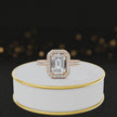 360° video of an Emerald Cut Halo Lab-Grown Diamond Engagement Ring in 18kt Rose Gold featuring an emerald-cut centre diamond, sparkling diamond halo and diamond-set shoulders.