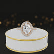 360° video of an Oval Cut Halo Lab-Grown Diamond Engagement Ring in 18kt Rose Gold featuring an oval-cut centre diamond, sparkling diamond halo and diamond-set shoulders.