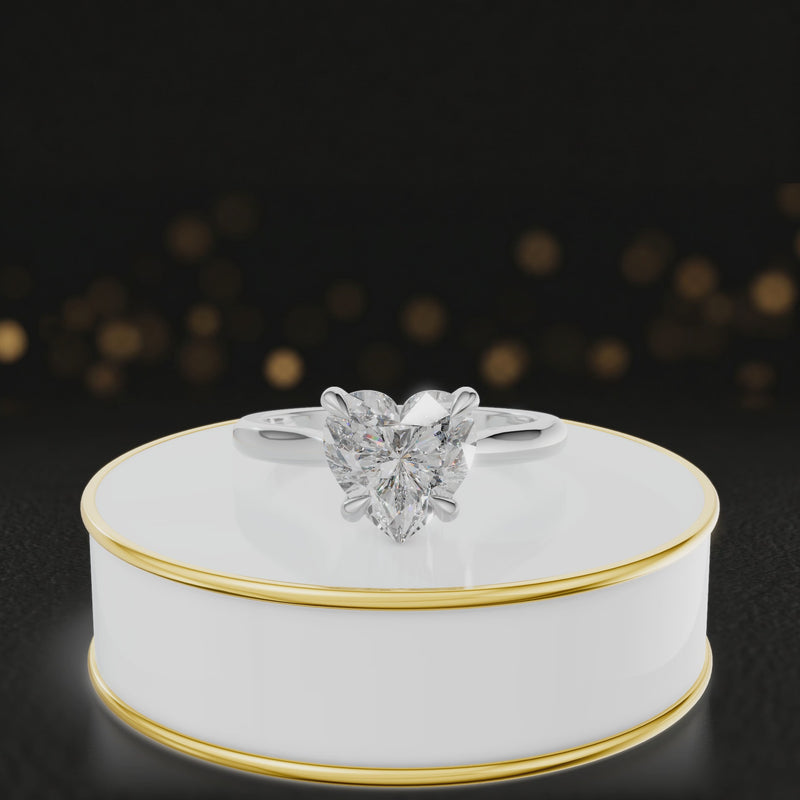 360-degree rotating view of a 1.5 carat heart cut diamond solitaire engagement ring in an 18kt white gold 4 claw setting by TJ Diamond