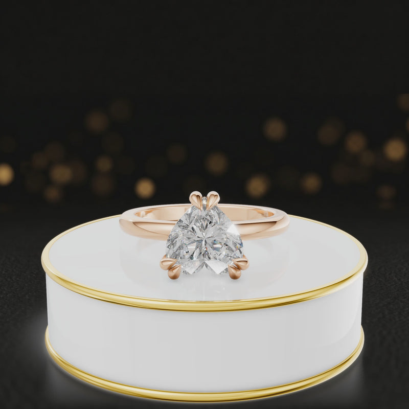 360-degree rotating view of a 1.5 carat heart cut diamond solitaire engagement ring in an 18kt rose gold 6 claw setting by TJ Diamond