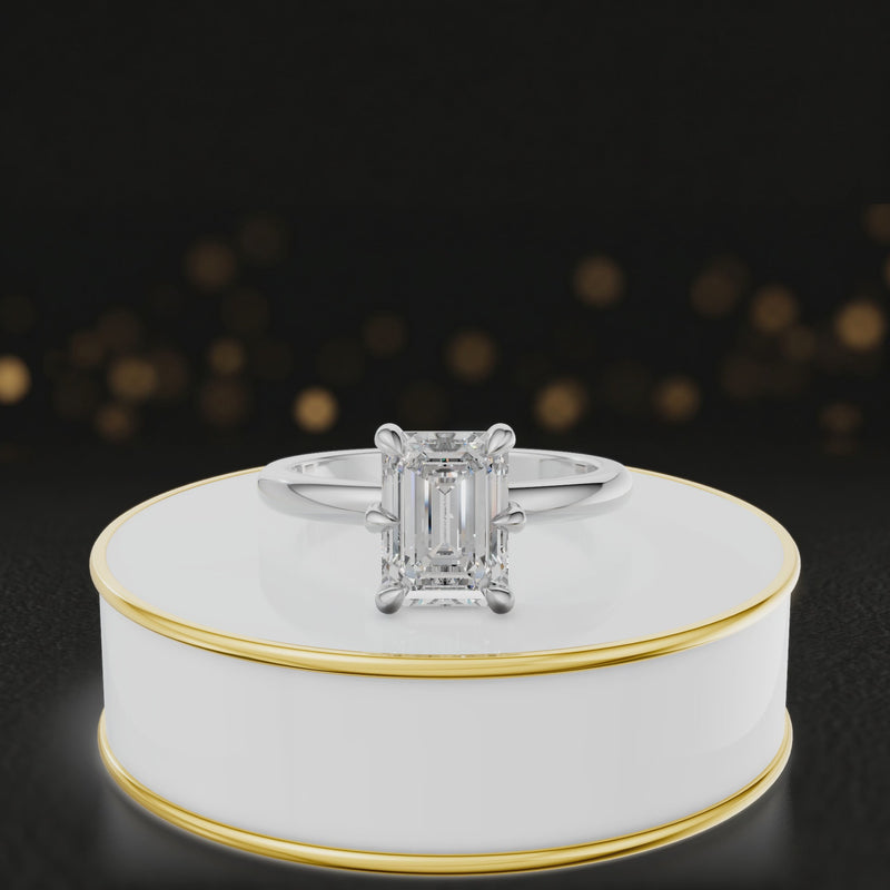 360-degree rotating view of a 1.5 carat emerald cut diamond solitaire engagement ring in an 18kt white gold 6 claw setting by TJ Diamond