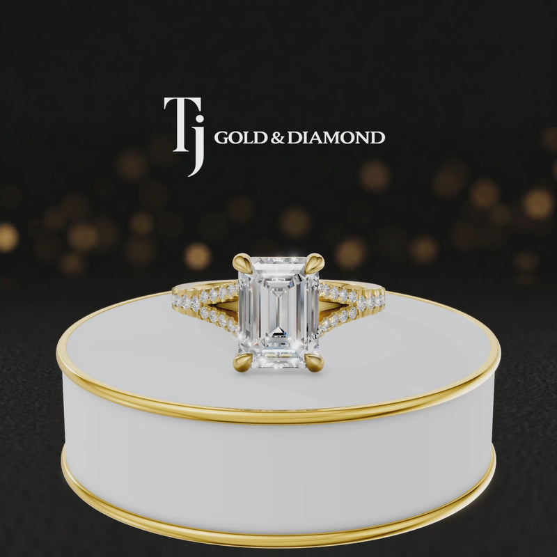 360° product view of an emerald cut split shank lab-grown diamond engagement ring in 18kt yellow gold featuring an emerald-cut centre diamond, classic four-claw cathedral setting and diamond-set split shank.