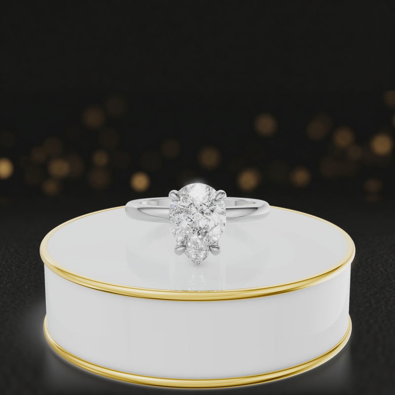 360 degree spinning video of 4-claw pear cut engagement ring with hidden halo in 18kt white gold