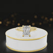 360-degree rotating view of a 1.5 carat emerald cut diamond solitaire engagement ring in an 18kt yellow gold 6 claw setting by TJ Diamond