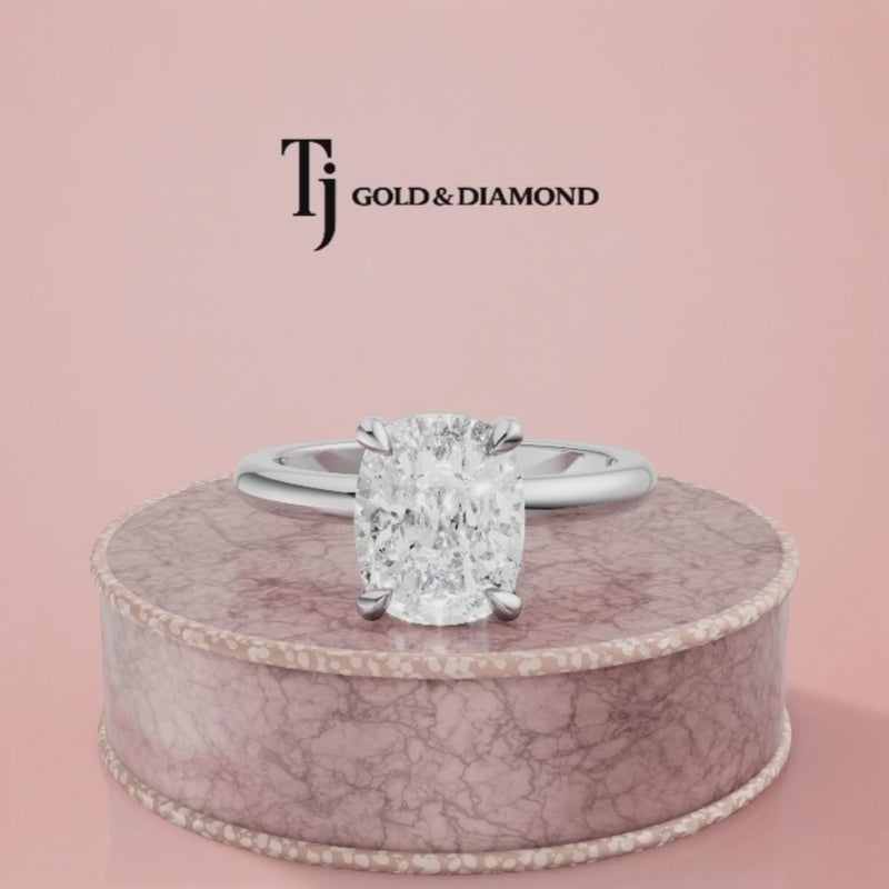 360-degree spinning view of a 1.5 carat cushion cut lab-grown diamond solitaire engagement ring in 18kt white gold with a 4-claw setting