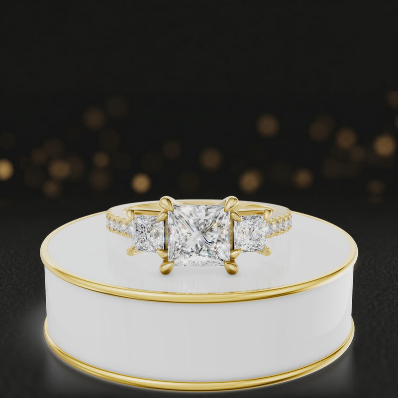 360-degree spinning view of a princess cut three-stone lab-grown diamond engagement ring in 18kt yellow gold with diamond shoulders