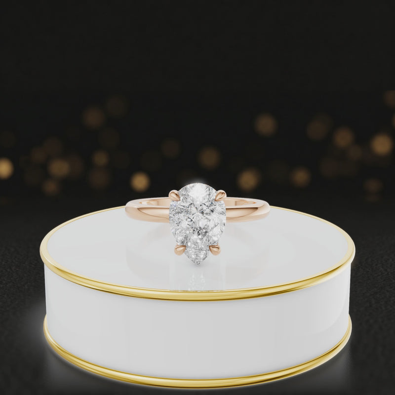 360 degree spinning video of 4-claw pear cut engagement ring with hidden halo in 18kt rose gold