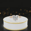 360-degree rotating view of a 1.5 carat heart cut diamond solitaire engagement ring in an 18kt rose gold 4 claw setting by TJ Diamond