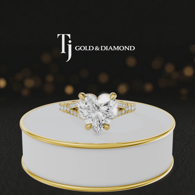 360° product view of a heart cut split shank lab-grown diamond engagement ring in 18kt yellow gold featuring a heart-cut centre diamond, classic four-claw cathedral setting and diamond-set split shank.