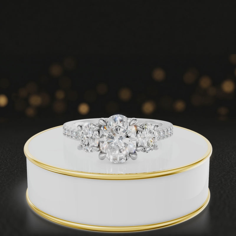 360-degree spinning view of an oval cut three-stone lab-grown diamond engagement ring in 18kt white gold with diamond shoulders