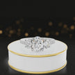 360-degree spinning view of an oval cut three-stone lab-grown diamond engagement ring in 18kt white gold with diamond shoulders