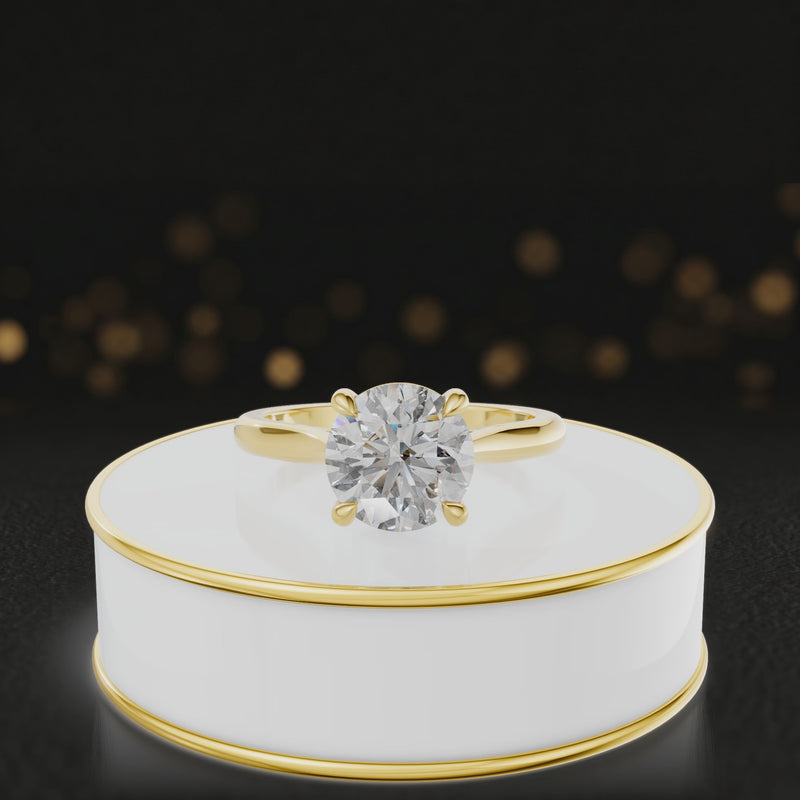 360-degree rotating view of a 1.5 carat round brilliant cut diamond solitaire engagement ring in an 18kt yellow gold 4 claw setting by TJ Diamond