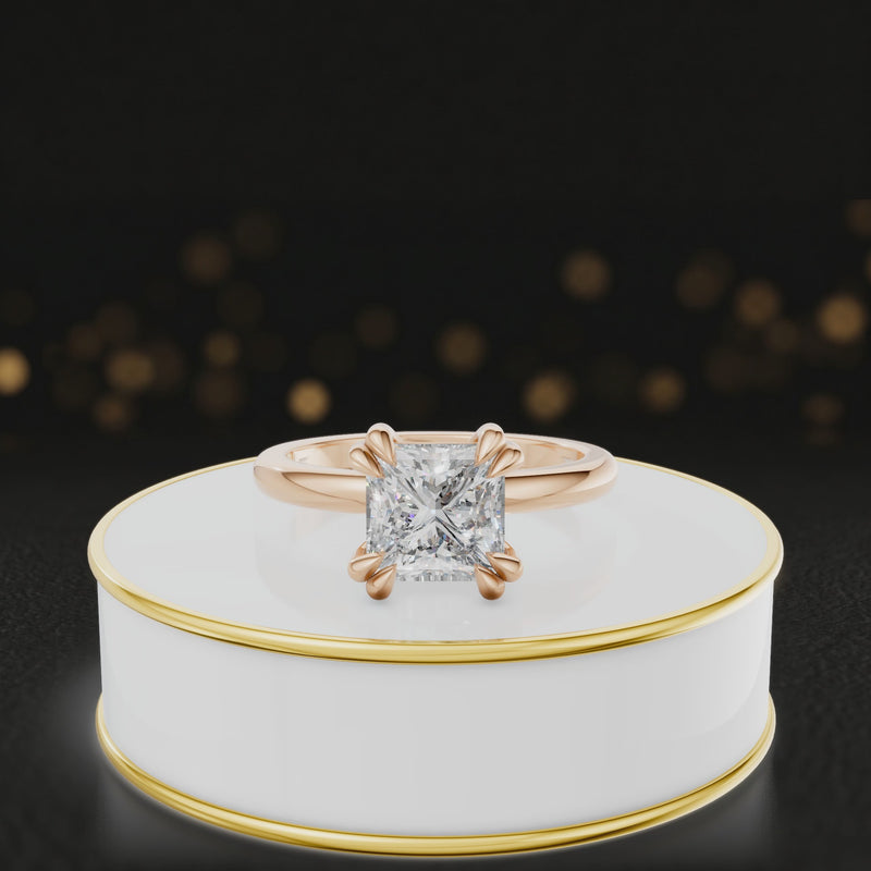 360-degree rotating view of a 1.5 carat princess cut diamond solitaire engagement ring in an 18kt rose gold 4 double claw setting by TJ Diamond