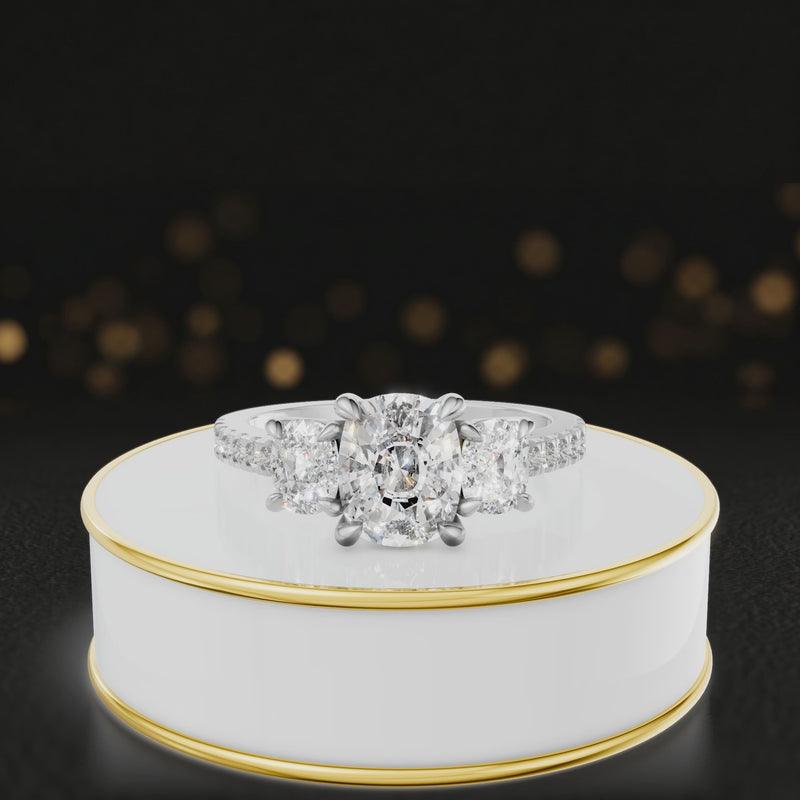 360-degree rotating view of a cushion cut three-stone diamond engagement ring in 18kt white gold with diamond shoulders