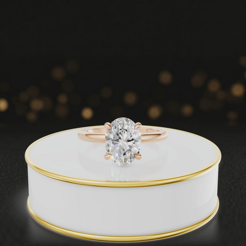 360 degree spinning video of 4-claw oval cut engagement ring with hidden halo in 18kt rose gold