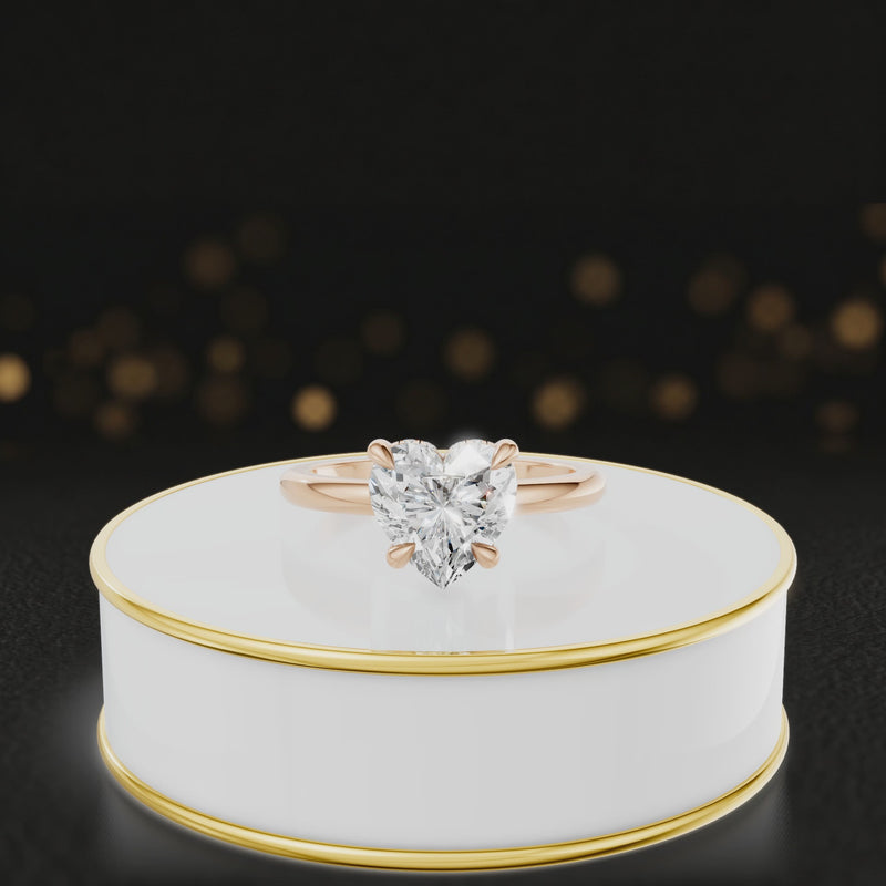 360 degree spinning video of 4-claw heart cut engagement ring with hidden halo in 18kt rose gold