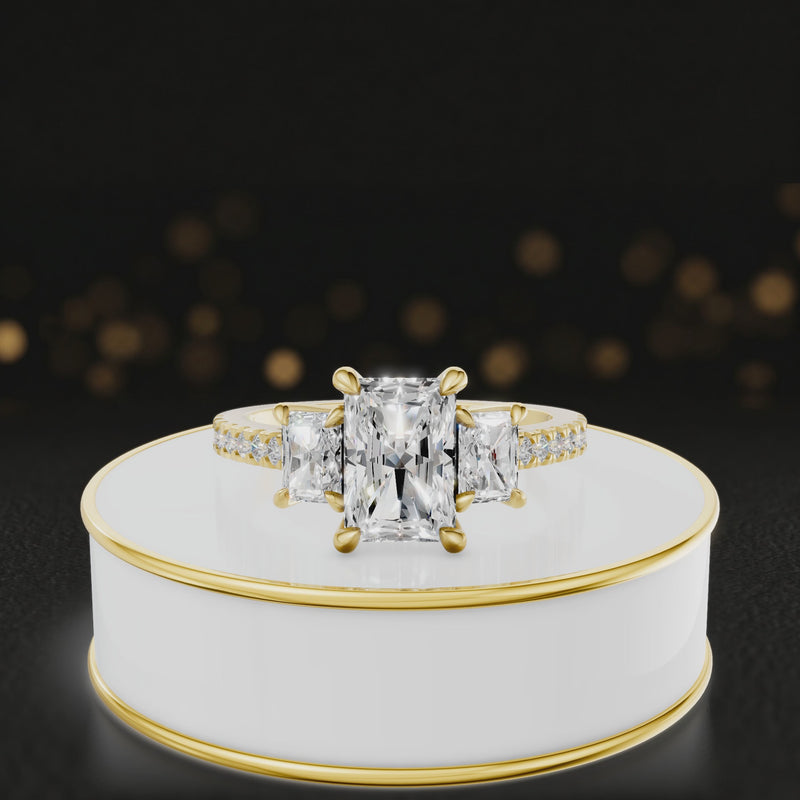360-degree spinning view of a radiant cut three-stone lab-grown diamond engagement ring in 18kt yellow gold with diamond shoulders