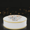 360-degree spinning view of a round cut three-stone lab-grown diamond engagement ring in 18kt rose gold with diamond shoulders