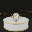 360° video of an Oval Cut Halo Lab-Grown Diamond Engagement Ring in 18kt Yellow Gold featuring an oval-cut centre diamond, sparkling diamond halo and diamond-set shoulders.