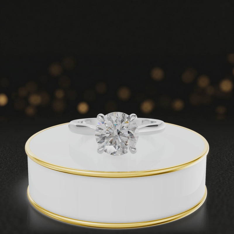 360-degree rotating view of a 1.5 carat round brilliant cut diamond solitaire engagement ring in an 18kt white gold 4 claw setting by TJ Diamond