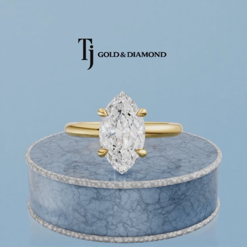 360-degree rotating view of a 1.5 carat marquise cut lab-grown diamond solitaire engagement ring in 18kt yellow gold with a 4-claw setting
