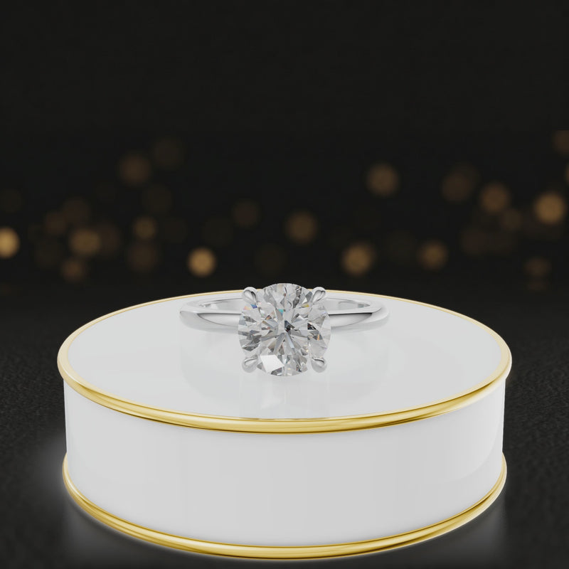 360-degree spinning video of a round cut lab-grown diamond engagement ring with hidden halo in 18kt white gold
