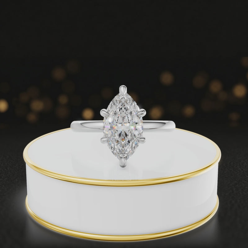 360-degree rotating view of a 1.5 carat marquise cut diamond solitaire engagement ring in an 18kt white gold 6 claw setting by TJ Diamond