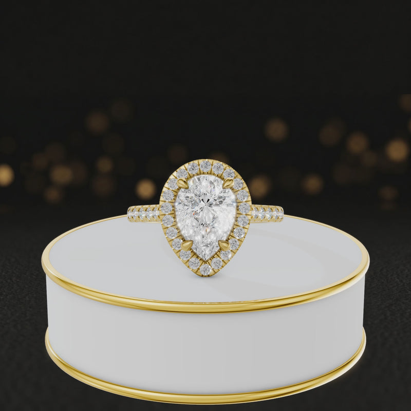 360° video of a Pear Cut Halo Lab-Grown Diamond Engagement Ring in 18kt Yellow Gold featuring a pear-cut centre diamond, sparkling diamond halo and diamond-set shoulders.