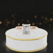 360-degree rotating view of a 1.5 carat emerald cut diamond solitaire engagement ring in an 18kt rose gold 4 claw setting by TJ Diamond