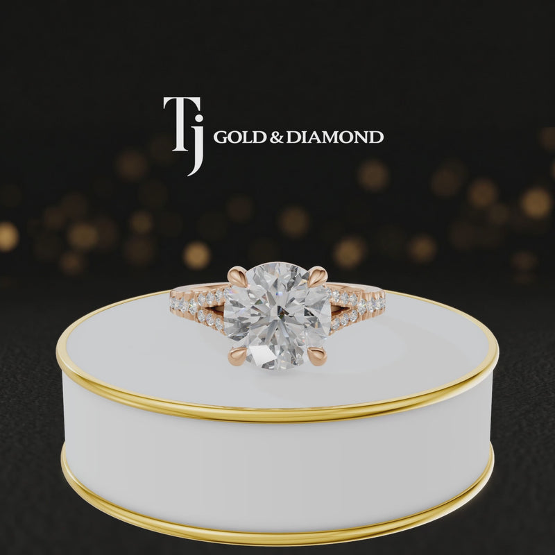 360° product view of a round cut split shank lab-grown diamond engagement ring in 18kt rose gold featuring a round brilliant centre diamond, classic four-claw cathedral setting and diamond-set split shank.