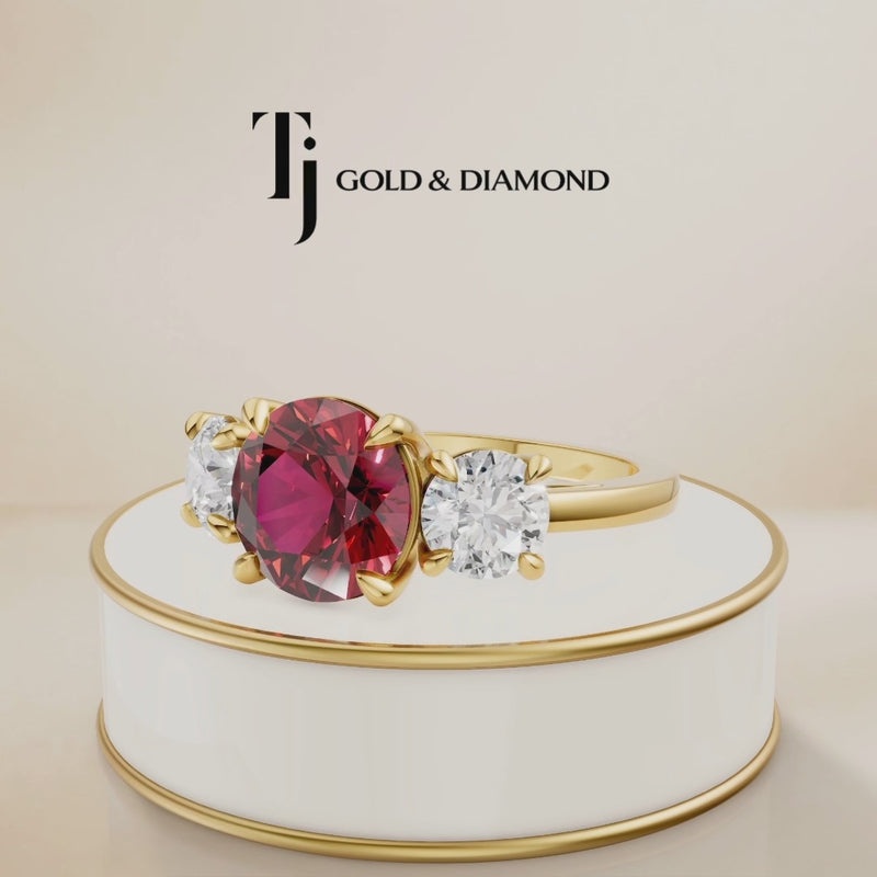 360° product view of a round brilliant lab-created ruby trilogy engagement ring in 18kt yellow gold with round brilliant lab-grown diamond side stones and a classic four claw basket setting.